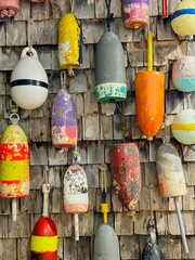 A vibrant wall of colorful lobster buoys