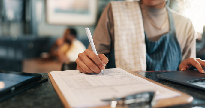 Writing, checklist and planning with hands in cafe for product inventory, supplier list or budget clipboard. Menu discount, restaurant and small business owner with closeup of person in coffee shop