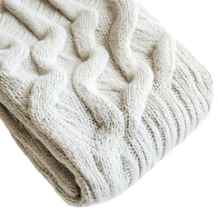 Fototapeta premium Close-up of a cream-colored knitted throw blanket