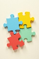 Obraz premium Colorful Puzzle Pieces Interlocking to Form a Complete Unit, Representing Teamwork and Collaboration