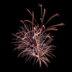 Colorful celebration fireworks isolated on a black sky background.
