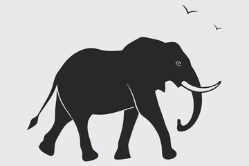 an elephant walking through the savanna.silhouette vector design art and illustration