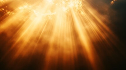 Beams of golden light shine through the cloudy sky