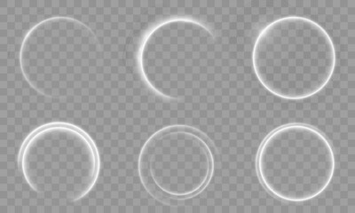 A set of glowing white circular light effects on a transparent background. Includes neon rings, soft halos, curved light swirls, and radial glow effects for design and graphic overlays.