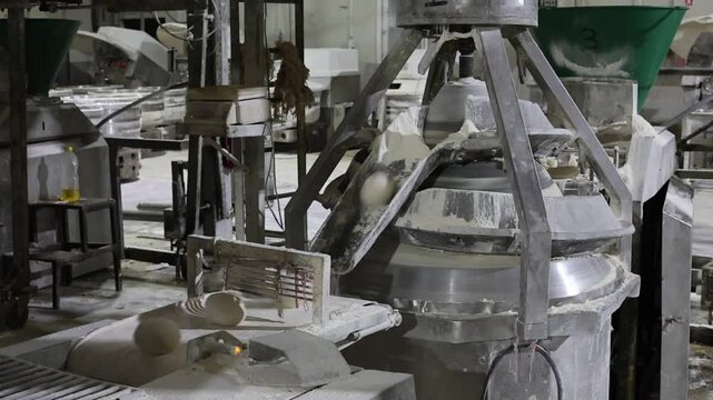 automatic dough shaping machine in an industrial bread factory