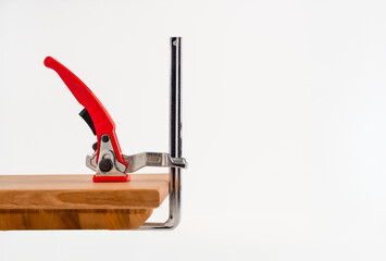 Quick release ratchet MFT table and track saw clamp isolated on a white background with copy space