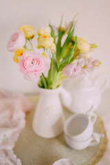 Soft Spring Table Setting with Pastel Flowers and Vintage Decor