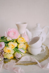 Soft Spring Table Setting with Pastel Flowers and Vintage Decor
