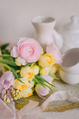 Soft Spring Table Setting with Pastel Flowers and Vintage Decor