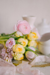 Soft Spring Table Setting with Pastel Flowers and Vintage Decor