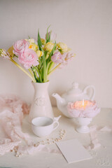 Soft Spring Table Setting with Pastel Flowers and Vintage Decor