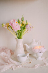 Soft Spring Table Setting with Pastel Flowers and Vintage Decor