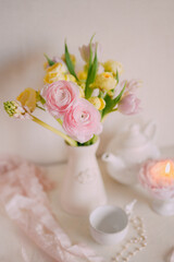 Soft Spring Table Setting with Pastel Flowers and Vintage Decor