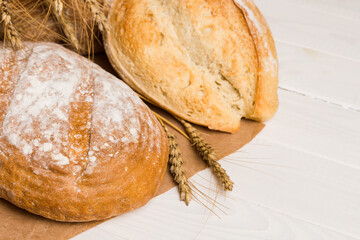 Homemade natural breads. Different kinds of fresh bread as background, perspective view with copy space