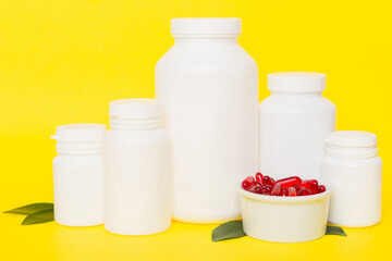 different drugs and health supplement pills with medicine bottle health care and medical top view. Vitamin tablets. Bottle with colored pills on table background. Multivitamins