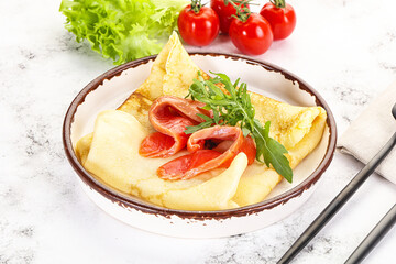 Russian pancake with salmon fish