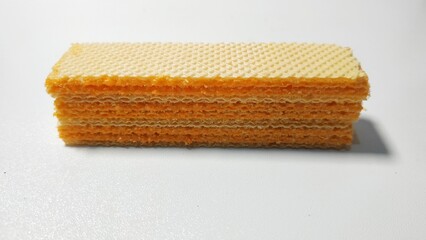 three layered wafers, with cheese paste, on an isolated white background