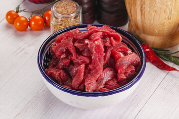 Raw beef meat - sliced strips
