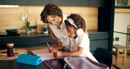 Mom, homework or child learning with headphones in kitchen for academic podcast or math assignment. African family, student or books with lesson support, knowledge development or study audio in home