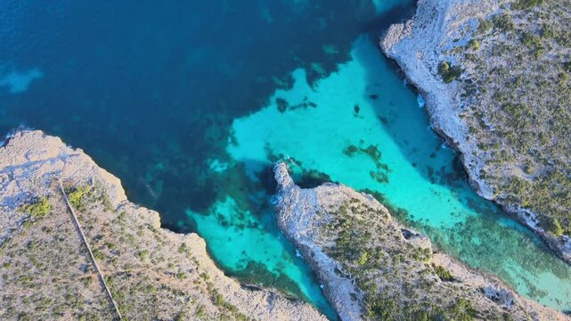 Discover the breathtaking beauty of Cala Varques in Porto Cristo, Majorca. Crystal clear waters meet rugged cliffs in this serene coastal paradise, perfect for relaxation and adventure.