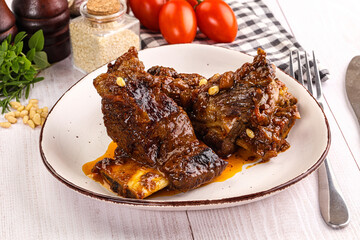 Prepared tasty beef ribs with sauce