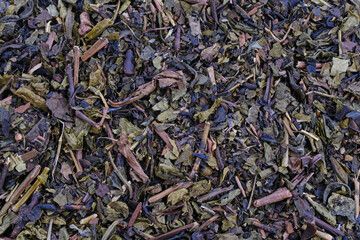 Dried tea leaves, textured background
