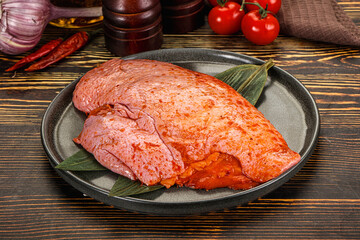 Raw marinated duck breast for cooking