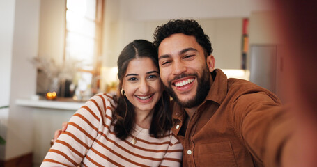 Fototapeta premium Couple, selfie and laughing in home embrace, photography and capture memory in relationship. Partner, romance and social media update on commitment, bonding and post moment of affection in marriage