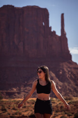 Happy young woman in beautiful Monument Valley on vacation