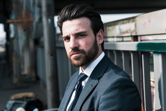 Confident businessman with beard at station