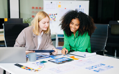 UX developer and ui designer brainstorming about mobile app interface wireframe design
