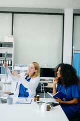  Doctors and nurses using laptops and clipboards, showcasing teamwork, modern healthcare.