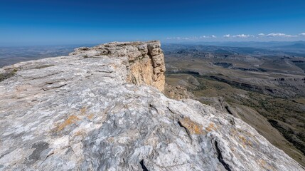 Fototapeta premium Mountaintop Vista, Rocky Cliff Face, Sunny Day