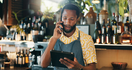 Phone call, tablet and checklist with black man in restaurant for product inventory, supplier contact or budget discussion. Menu discount, bar and small business owner with employee in coffee shop