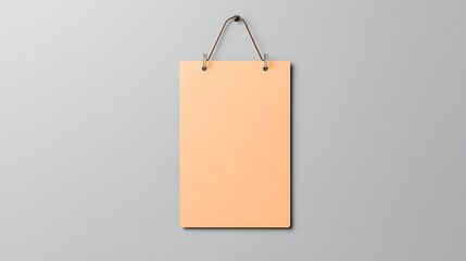 Blank hanging sign on a smooth gray background, ideal for customizable messages or branding
