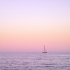 serene sunset over calm ocean with solitary sailboat on horizon, pastel sky, tranquil seascape, peaceful evening, relaxing nature scene