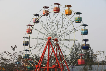 Wonder wheel in an amusement park.Ferris wheel.Ferris wheel on sky background in amusement park