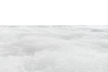 Snow on the beach. White water with ripples on the surface. Defocus blurred transparent white colored clear calm water surface texture with splashes and bubbles. Water waves with shining pattern.