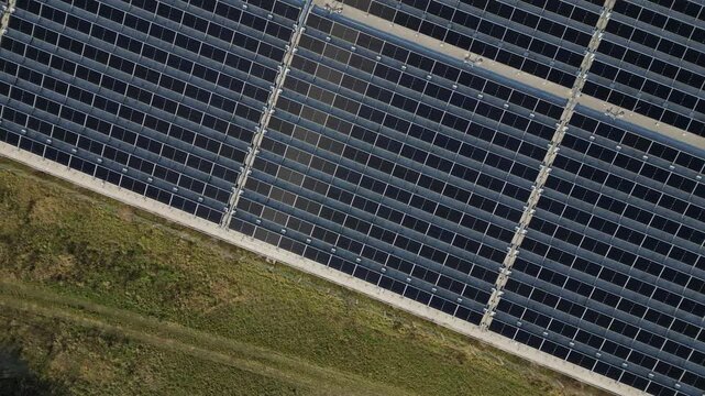 extensive roof of industrial and logistic hall are gradually being filled with solar panels. covering roofs helps industrial developer increase energy efficiency and sustainability site, building 