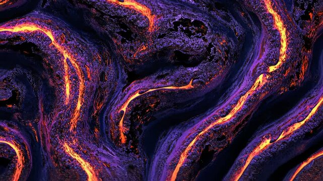 Flowing lava creates intricate patterns in a volcanic landscape during nightfall in Hawaii