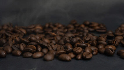  Roasted coffee beans are blackish brown, with a black background