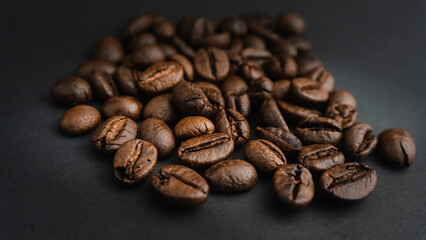  Roasted coffee beans are blackish brown, with a black background