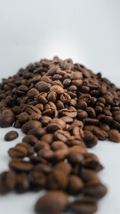  Roasted coffee beans are blackish brown, with a white background
