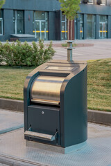 Modern garbage can in the courtyard of a high-rise building © eugenivy