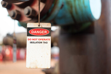 Isolation tag or lockout tagout which is hanged on pipeline valve that under maintenance, do not...