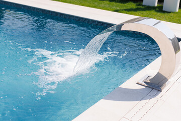 Modern Swimming Pool with Stainless Steel Waterfall