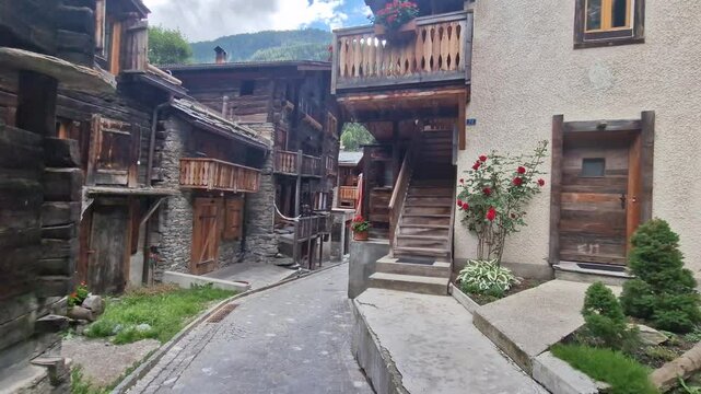 Zermatt old town. Pretty wooden houses and floral streets popular ski resort in Valais canton. Swiss traditional villages