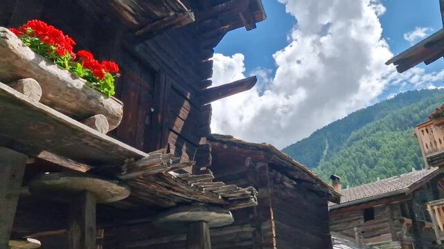 Zermatt old town. Pretty wooden houses and floral streets popular ski resort in Valais canton. Swiss traditional villages