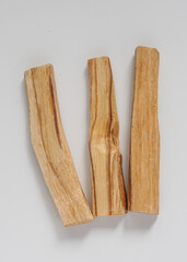  wooden palo santo sticks on a white background 
