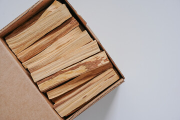 incense palo santo sticks wooden in a box on a white background flat lay copy space